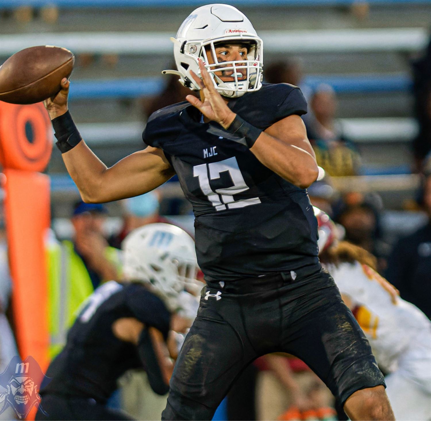 Keith Orona throwing a pass as quarterback number 12 for Modesto Junior College