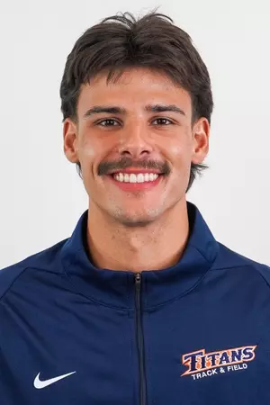 Keith Orona headshot in a Cal State Fullerton Track & Field jacket