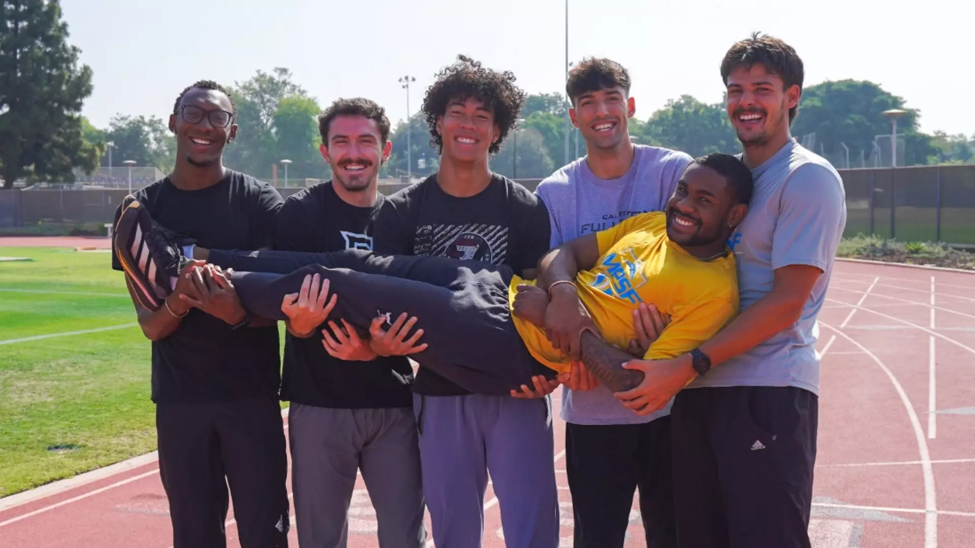 Keith Orona and the Cal State Fullerton decathletes on the track