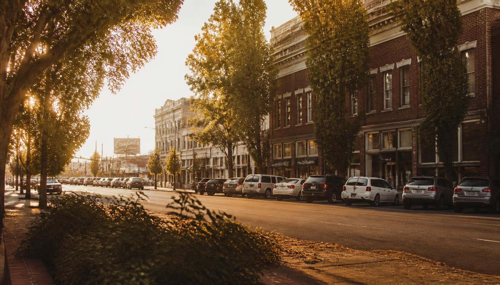 Golden hour on a tree-lined downtown Modesto street